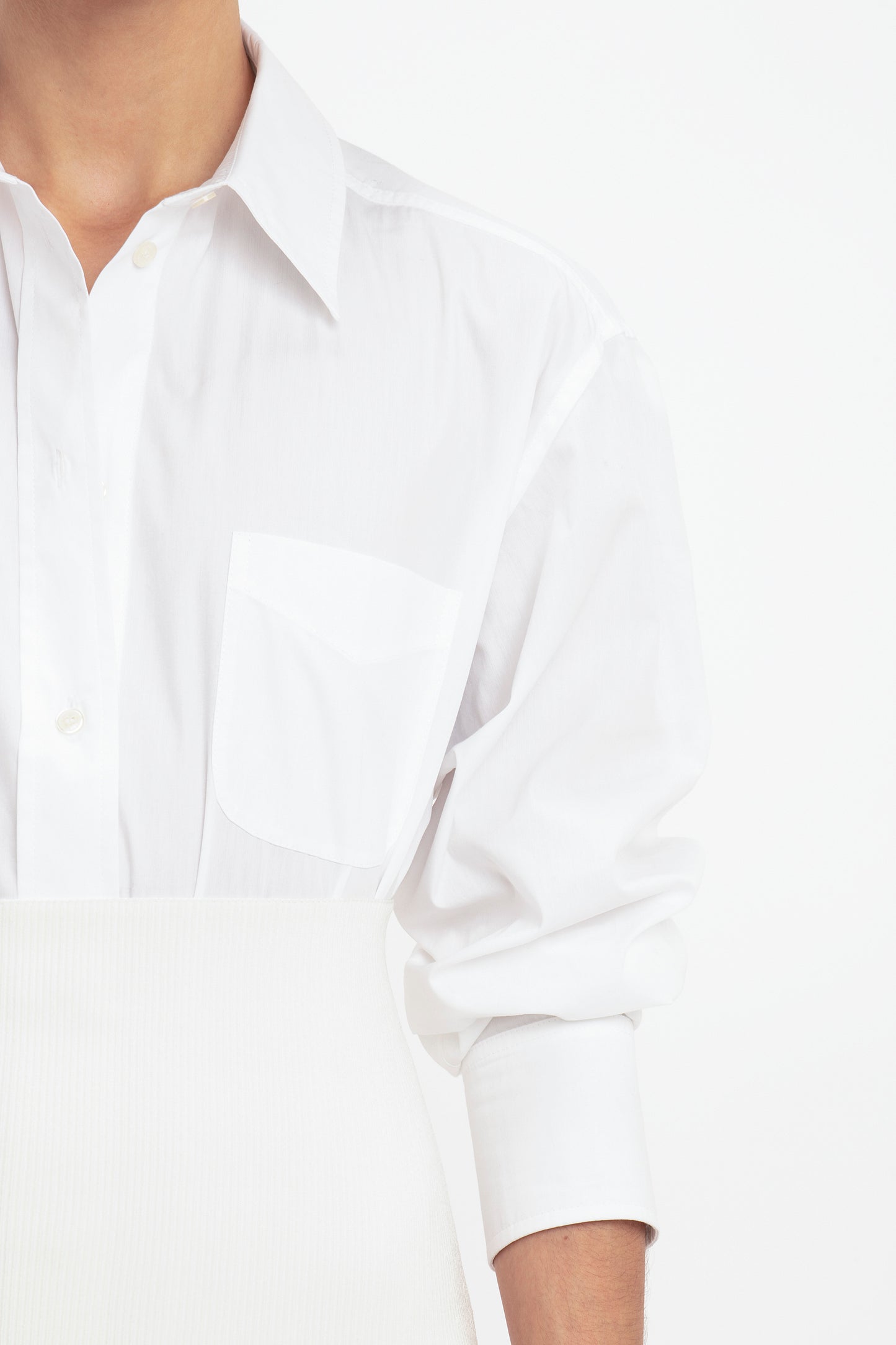 Close-up of a person wearing the VB Body Fitted Midi Skirt in White by Victoria Beckham, set against a plain white background.