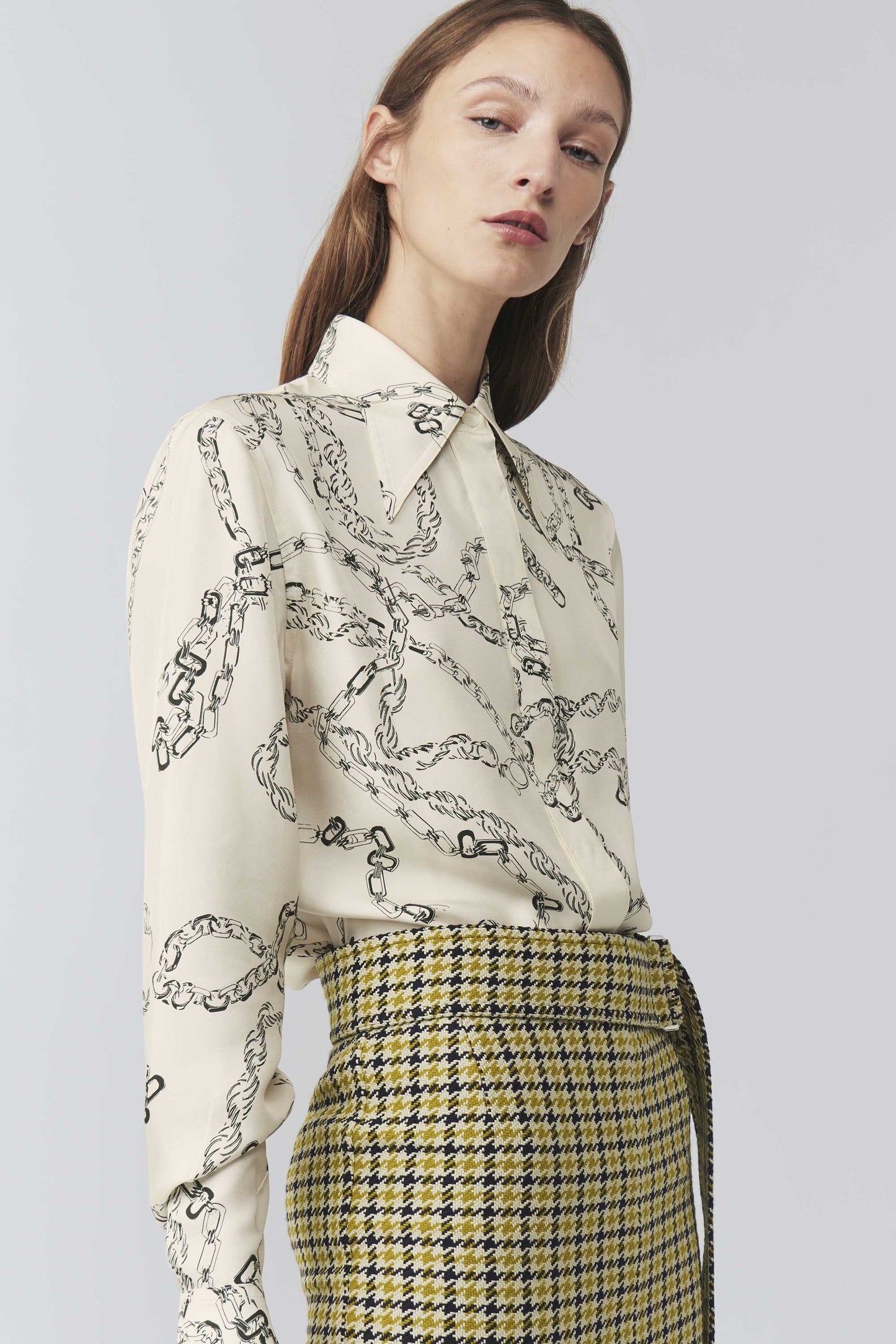 The model is wearing a Victoria Beckham 70's Collar Shirt.