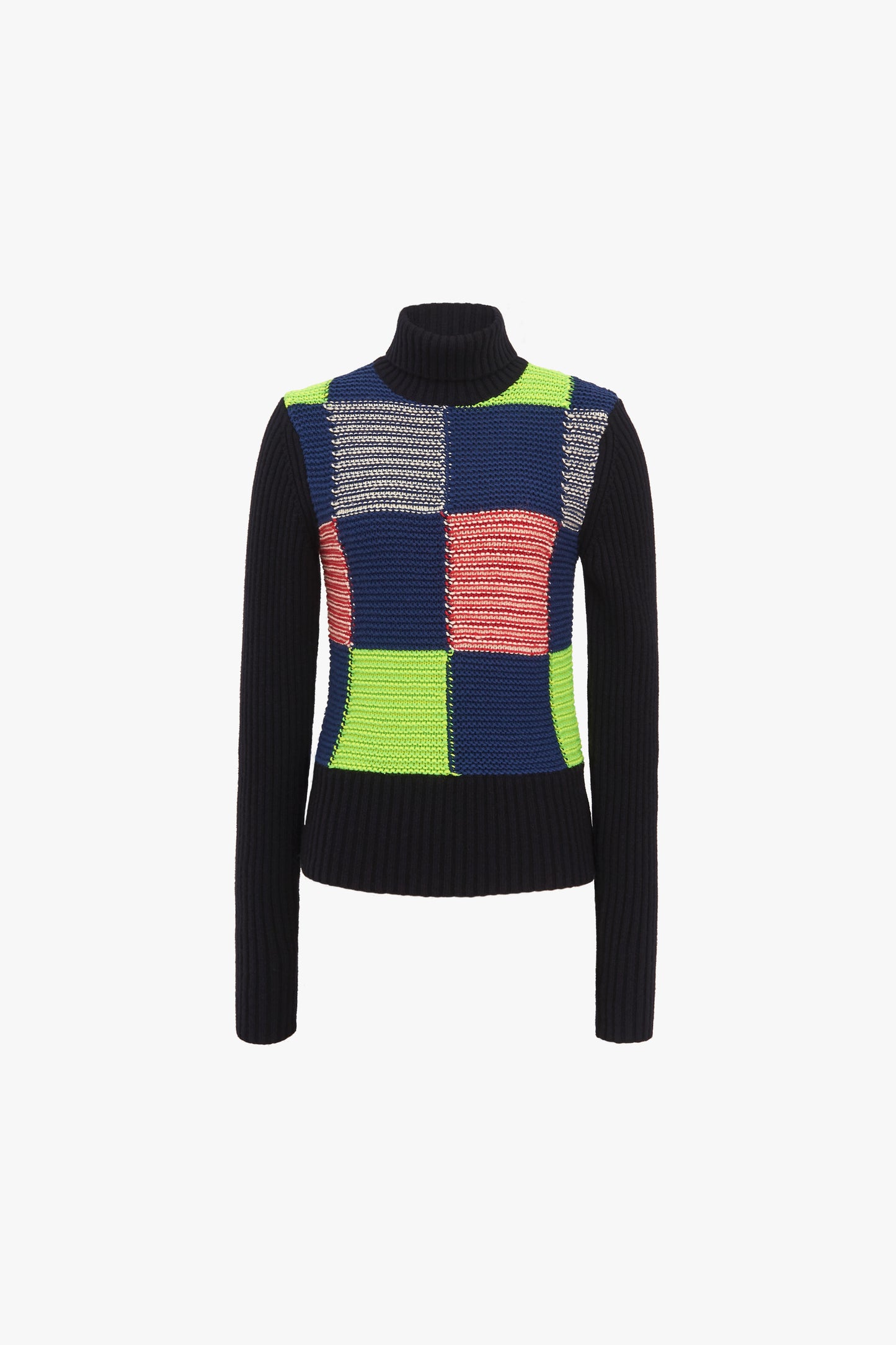 The Patchwork Polo Neck Jumper by Victoria Beckham is a knitted lambswool turtleneck featuring a vibrant multicolour patchwork design with blocks of blue, green, pink, and gray on the front; the sleeves and sides are solid black.