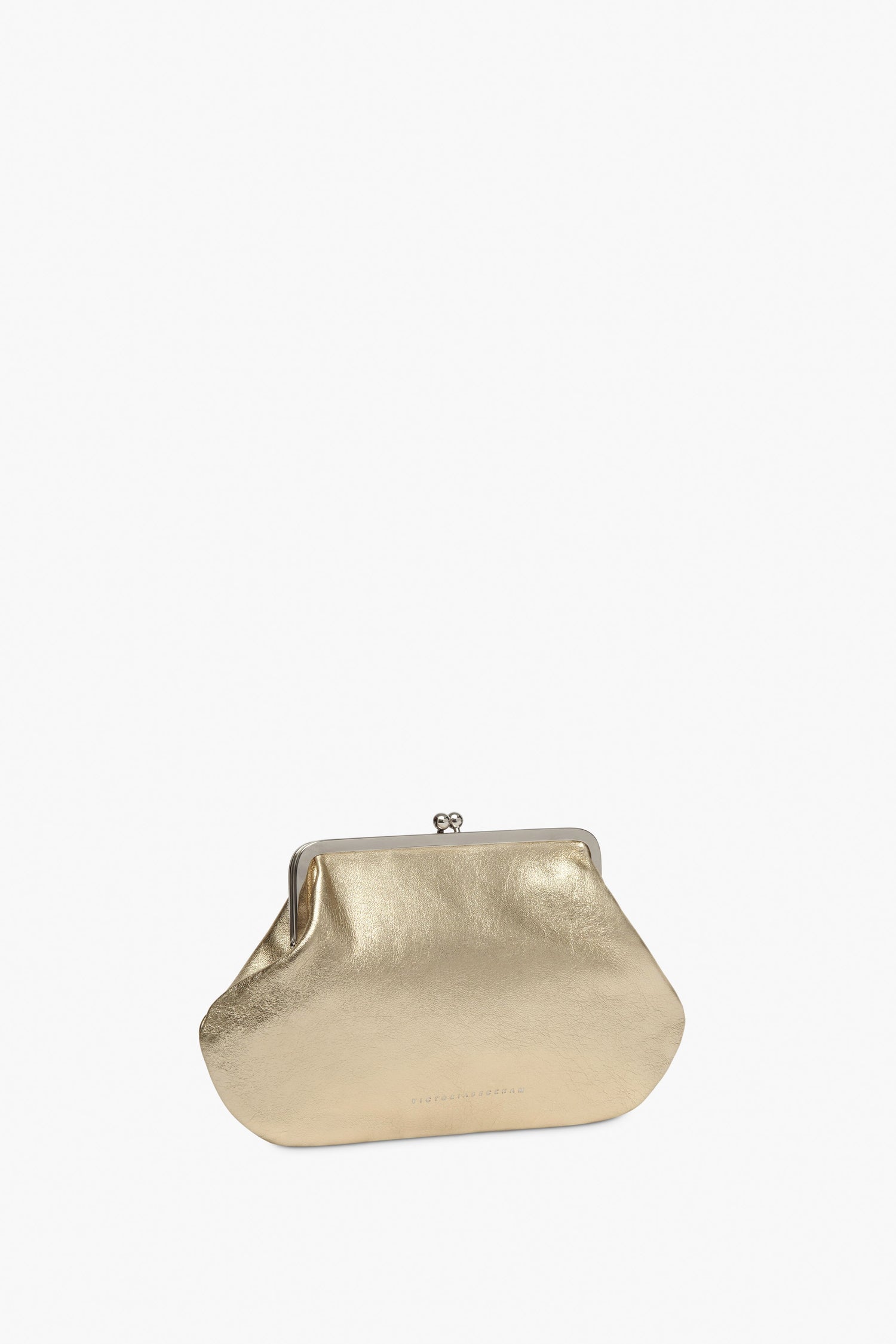 The Victoria Beckham Pocket Clutch in Gold features a kiss lock closure and a sleek silver frame, set against a plain white background.