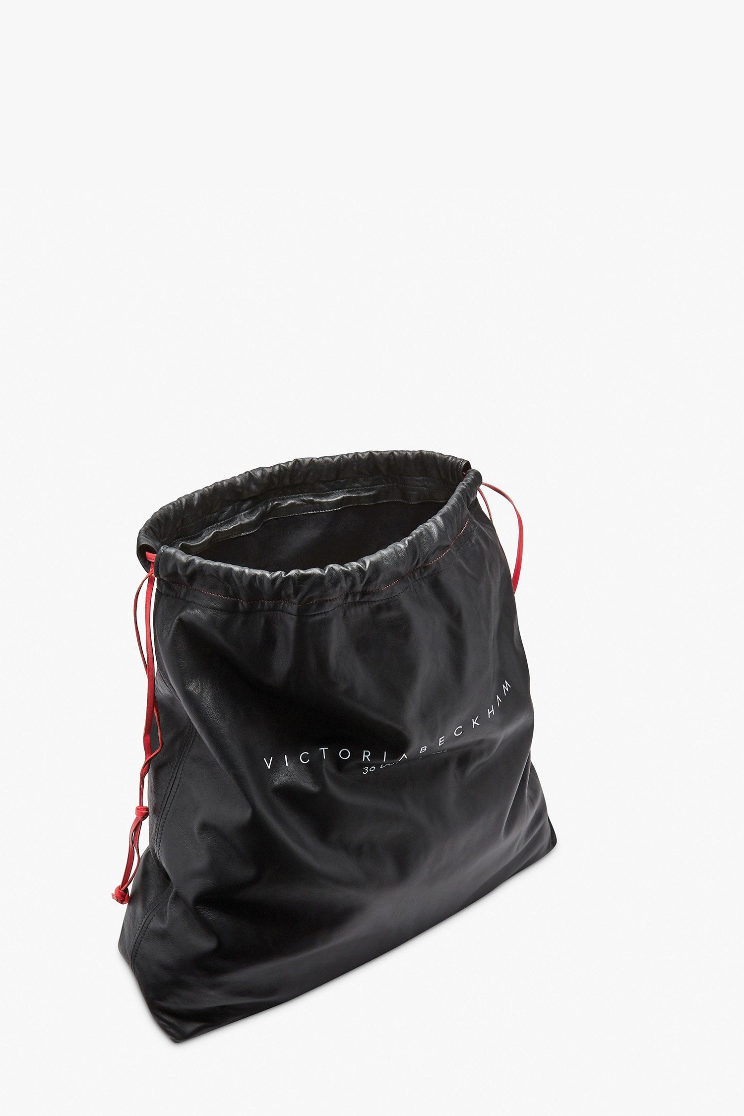 36 Dover St Drawstring Bag in black, perfect for a trip to Tommy Hilfiger or a stylish addition to your Victoria Beckham-inspired look.
